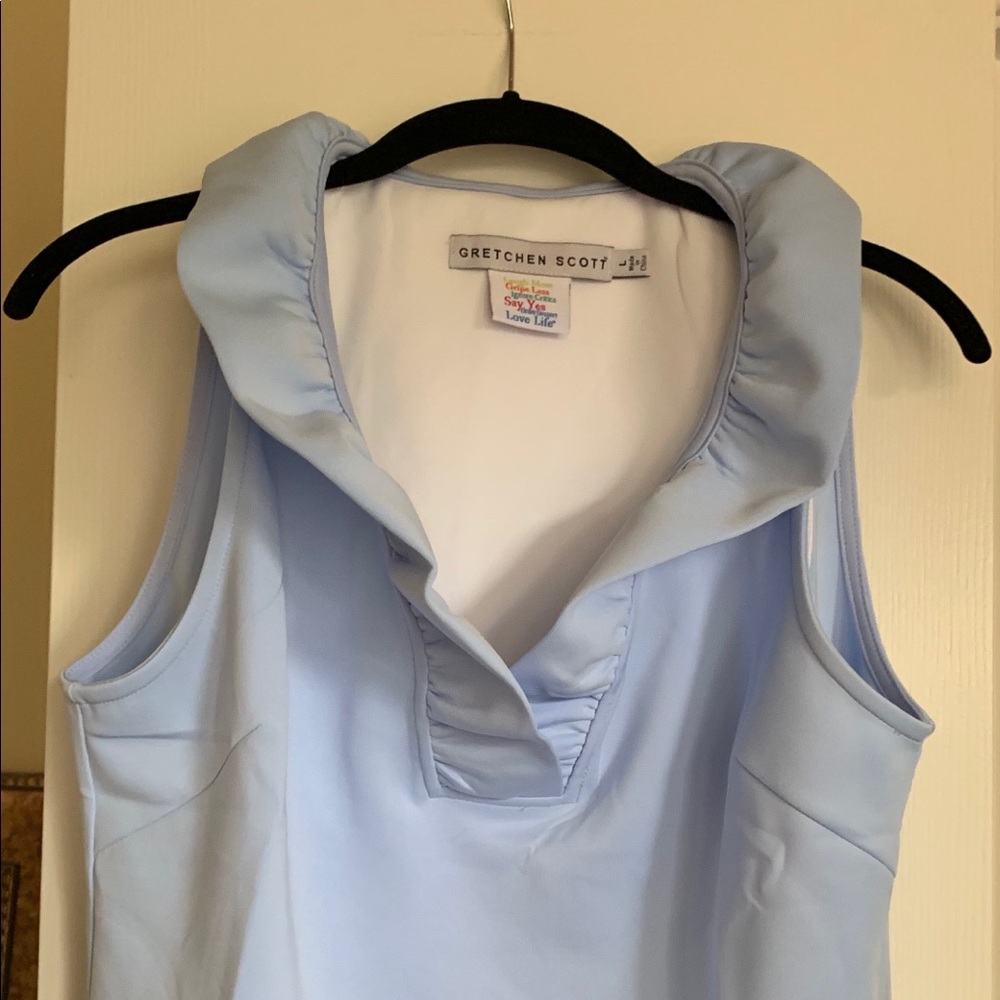 Sleeveless ruffle collar top